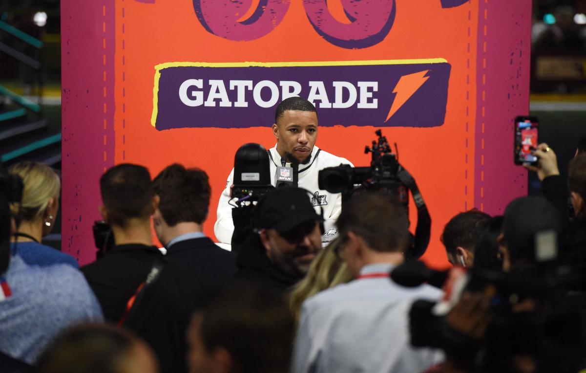 Philadelphia Eagles running back Saquon Barkley talks to members of the media Monday, Feb. 3, 2025, at the Super Bowl LIX Opening Night event in New Orleans.