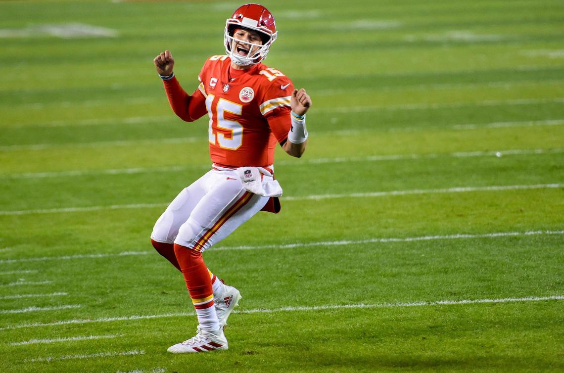 Chiefs quarterback Patrick Mahomes (15) celebrates a short touchdown pass to tight end Travis Kelce during the second-half of the AFC Championship Game Sunday, Jan. 24, 2021, at Arrowhead Stadium in Kansas City. The Chiefs defeated the Bills, 38-24, to head to the Super Bowl.