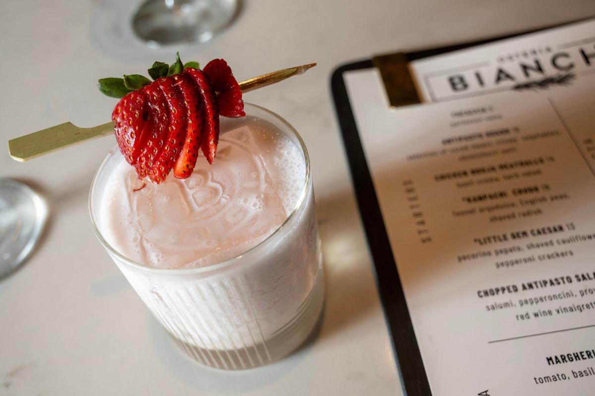 Osteria Bianchi’s Strawberry Bavarese is a refreshing dessert cocktail, featuring ripe strawberries and a frothy top.