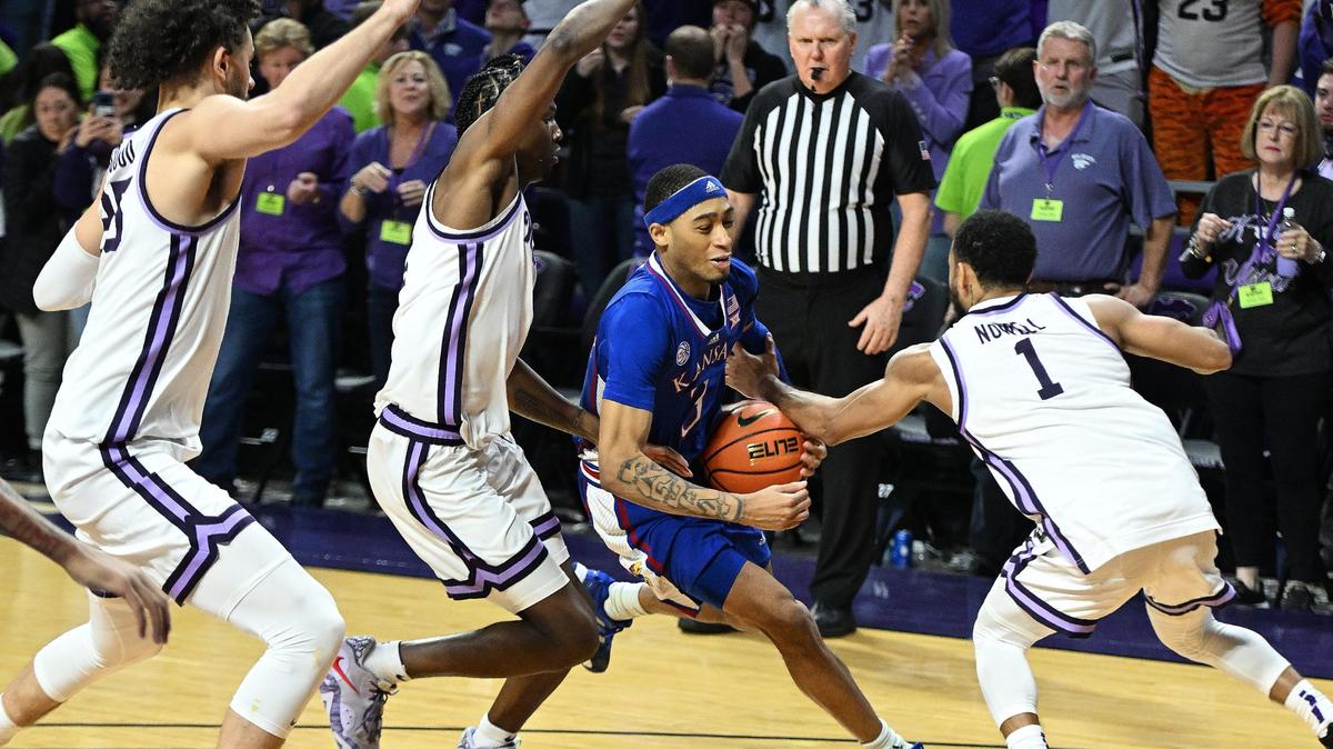 KU’s Dajuan Harris drives into a Kansas State triple team and loses the ball in the final seconds of the Wildcats’ 83-82 overtime win at Bramlage Coliseum.