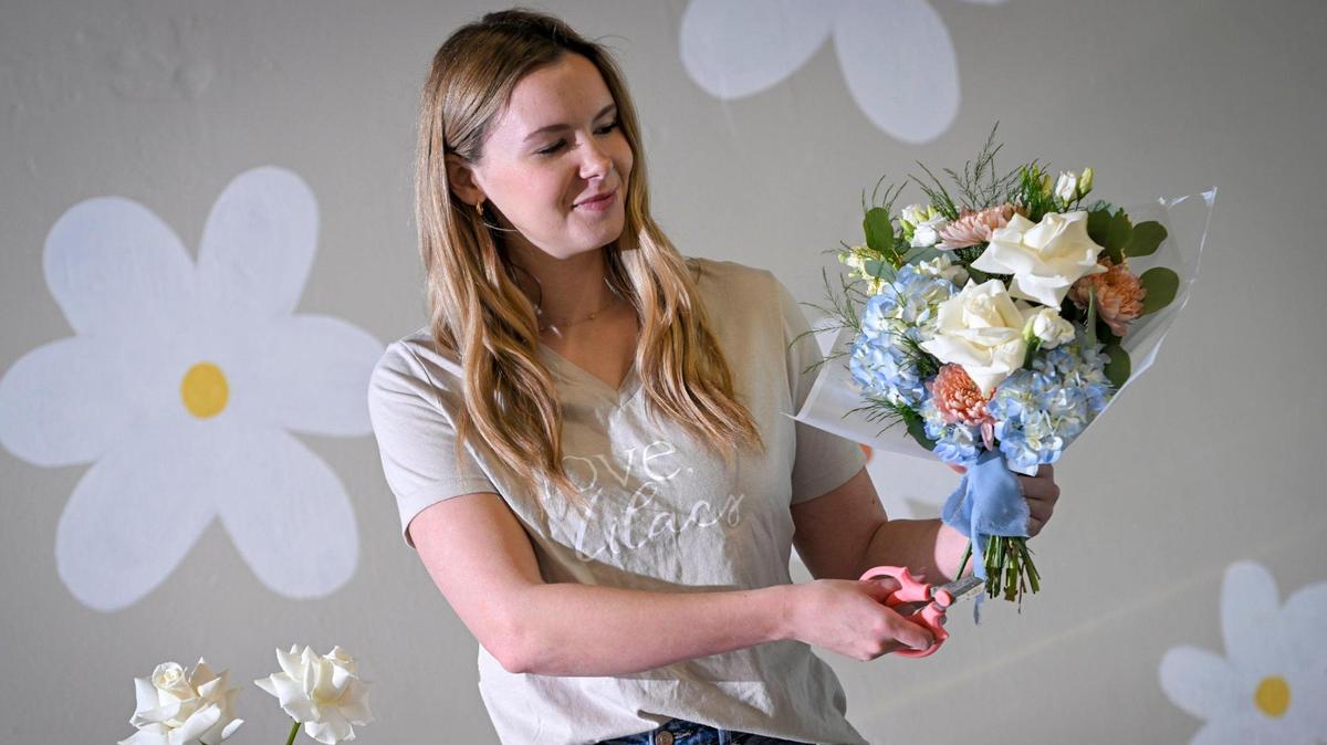 Lexi Nardini, 23, is owner of Love, Lilacs, 1520 Walnut St., a wedding floral business in Kansas City’s Crossroads Arts District. Nardini, displays a bouquet she made in about 10 minutes. She is a budding star on TikTok and Instagram.