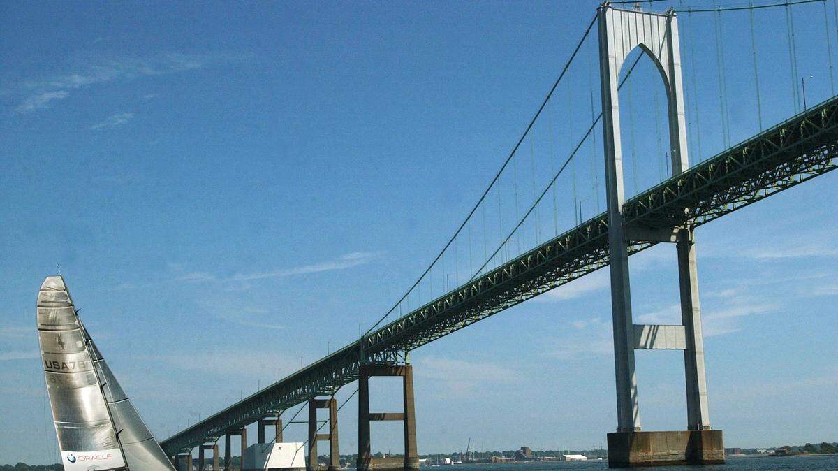 The USA-76 BMW ORACLE Racing America’s Cup yatch sails under the Newport Bridge in June 2004. A Rhode Island man named William Shakespeare and his wife were involved in an unusual boating incident when their sailboat hit a bridge, she fell off and the boat ran aground. They were cited with multiple violations.