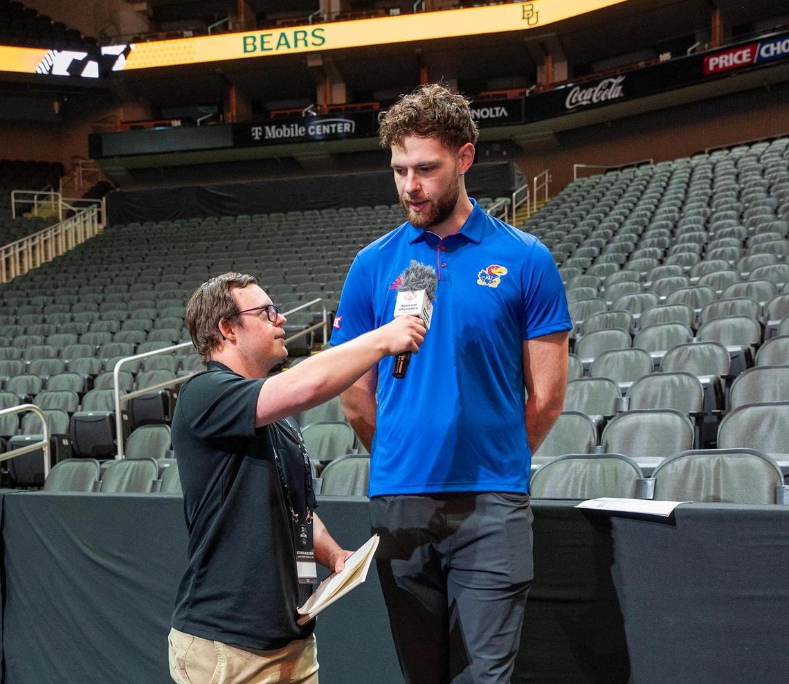Daniel Schnacker, a social media influencer for the Special Olympics, interviews Kansas Jayhawks’ Hunter Dickinson during Big 12 Men’s Basketball Media Day at T-Mobile Center on Wednesday, October 23, 2024, in Kansas City.