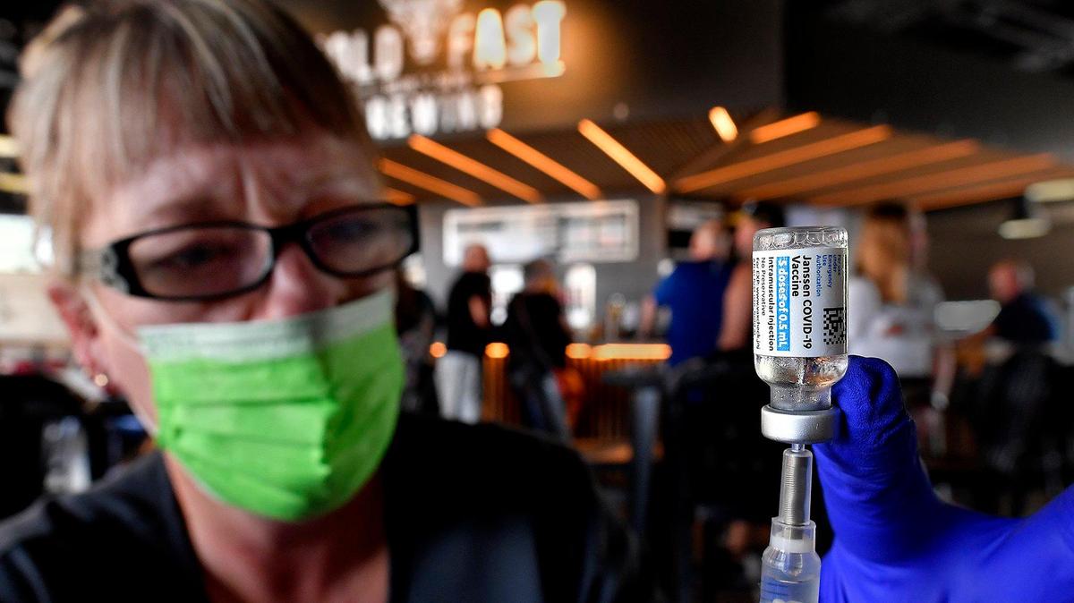 At a vaccination clinic dubbed “Pints and Pics for Pokes,” last week at Hold Fast Brewing in Springfield, Jody Preery, an LPN, draws a dose of the COVID-19 vaccine into a syringe. Southwest Missouri has been so ravaged by a surge in COVID cases that the Springfield-Greene County Health Department on Wednesday requested state aid to open up additional treatment beds.