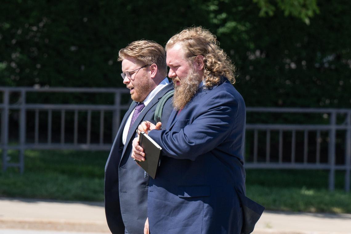 Cullen Jones, right, son of former Boilermakers International President Newton Jones, prepares to enter the Robert J. Dole Federal Courthouse in Kansas City, Kansas, on Sept. 3, 2024, for his initial court appearance on embezzlement and other felony charges.