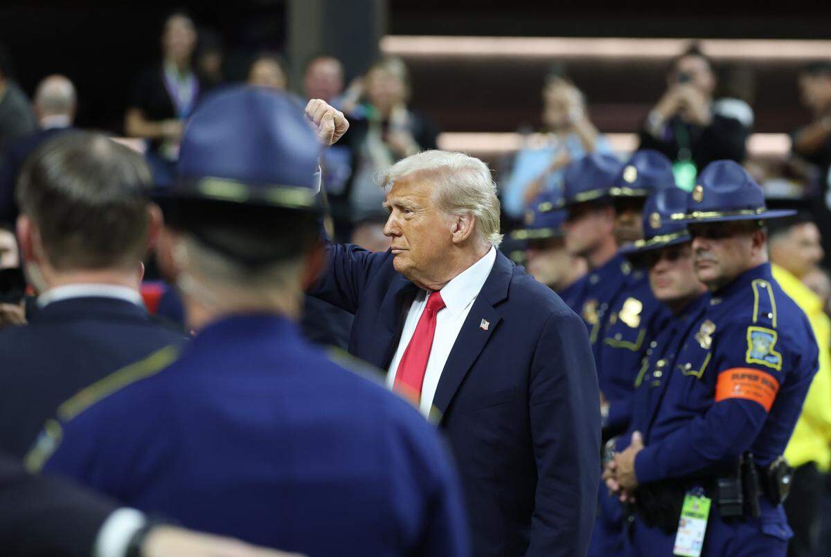 President Donald Trump waves as he walks onto the field before Super Bowl LIX between the Kansas City Chiefs and Philadelphia Eagles at the Ceasars Superdome in New Orleans on Sunday, Feb. 9, 2025.