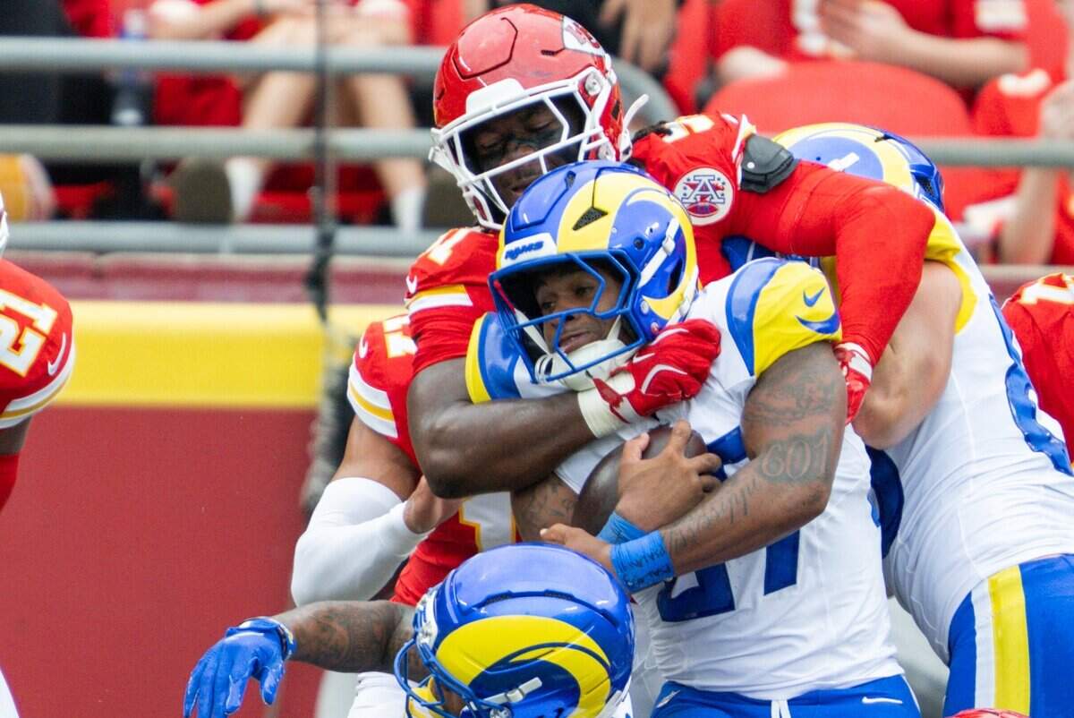 Kansas City Chiefs defensive end R. Mason Thomas (51) makes a tackle on Los Angeles Rams running back Jarquez Hunter (27) during the first half of the Chiefs preseason game against the Los Angeles Rams, on Saturday, August 15, 2026, at Arrowhead Stadium.