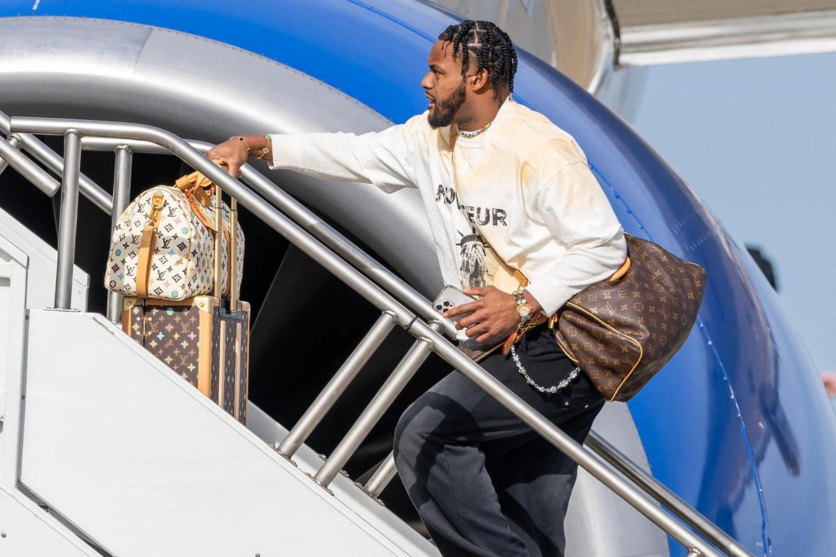 Kansas City Chiefs wide receiver JuJu Smith-Schuster boards a United Airlines flight with teammates from Kansas City International Airport on Sunday, Feb. 2, 2025, traveling to New Orleans for Super Bowl LIX.