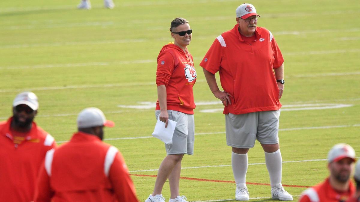 Coaching intern Katie Sowers and head coach Andy Reid chat during the Kansas City Chiefs training camp at Missouri Western State University in St. Joseph Friday, Aug. 6, 2021.