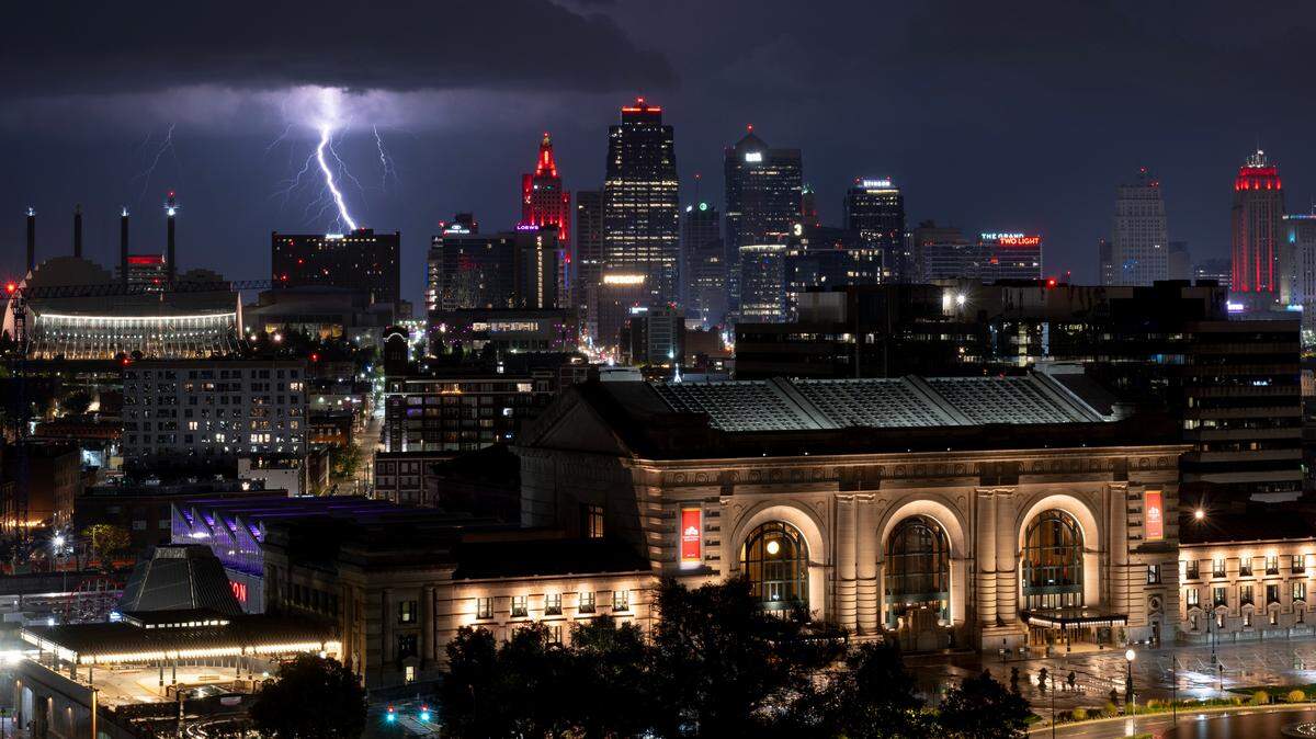 A bolt of lightning streaks through the sky near the downtown skyline on Oct. 4, 2023, in Kansas City. Jackson County residents have a new way to find out about severe weather, but they have to sign up to get the alerts.