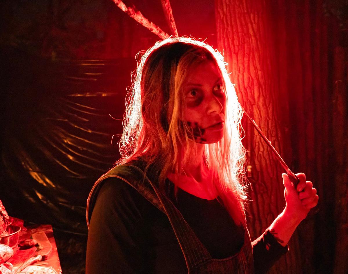 A scare actor along the terror trail at Exiled: Crooked Rose Woods.
