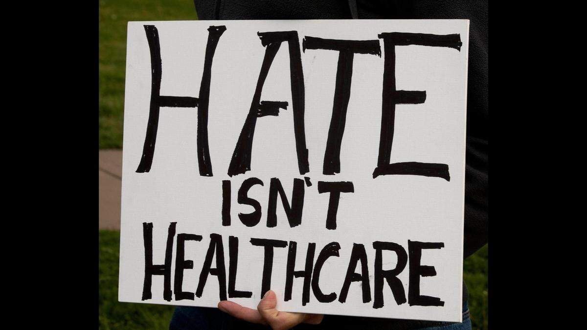 Transgender friends, family and communities gathered Sunday, April 16 at Mill Creek Park on the plaza to protest Attorney General Andrew Bailey’s new executive action so strict that it will essentially ban gender-affirming care for many adults and minors in Missouri.