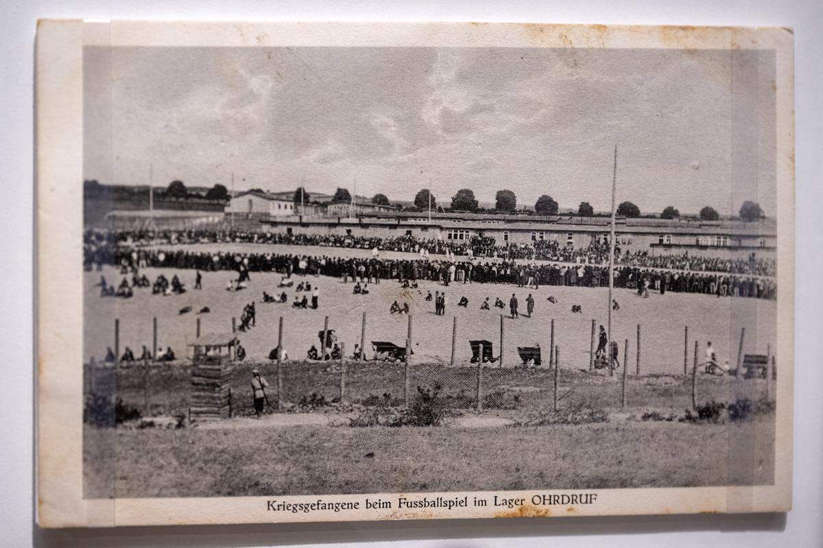 A German postcard depicting Allied prisoners of war playing football at Ordruf prison camp in Germany is displayed in the new exhibition “The Beautiful Game,” highlighting the role of soccer during World War I, at the National WWI Museum and Memorial on Wednesday, April 1, 2026, in Kansas City.