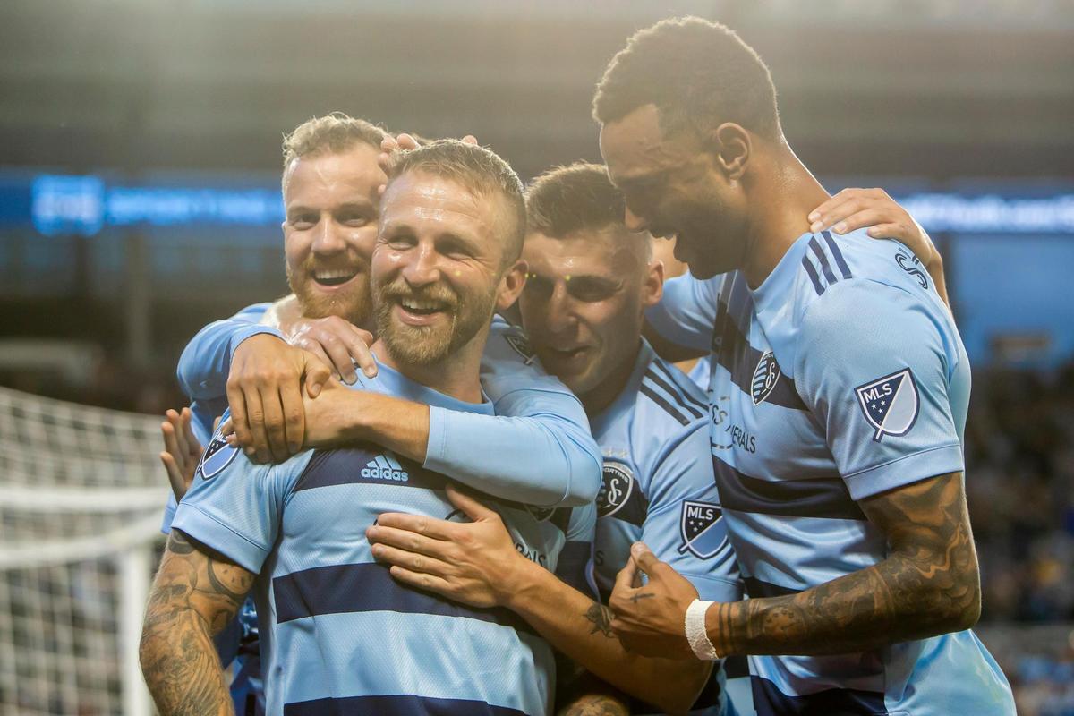 Sporting Kansas City forward Johnny Russell (7) celebrates with teammates after scoring a penalty kick during the match between Sporting Kansas City and FC Dallas on April 30, 2022 at Children’s Mercy Park in Kansas City, Kansas.