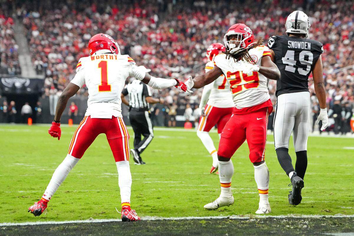 Kansas City Chiefs running back Kareem Hunt (No. 29) celebrates his first-half TD with wide receiver Xavier Worthy during a Sunday, Oct. 27, 2024 NFL Week 8 game against the Las Vegas Raiders at Allegiant Stadium in Paradise, Nevada.