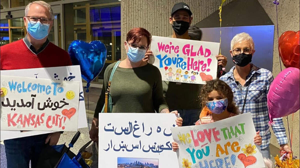 Church of the Resurrection senior pastor Adam Hamilton, left, and his family are among many in the community who have welcomed people resettled from Afghanistan.