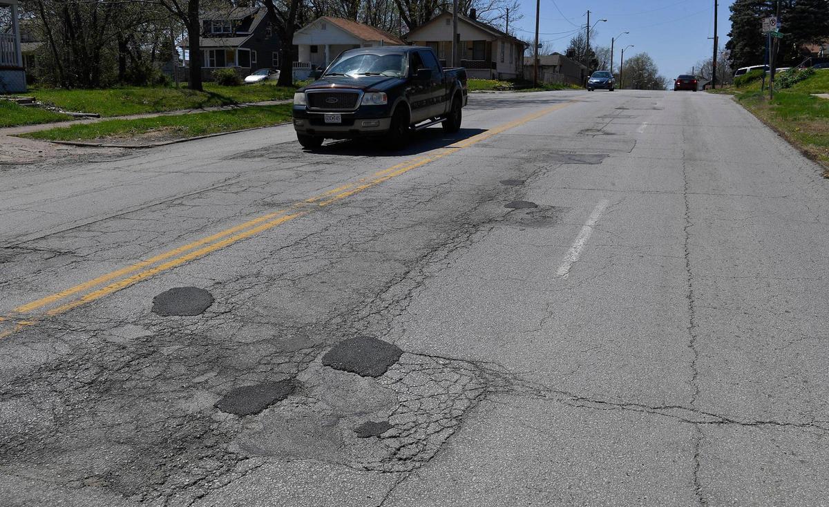 Potholes on 23rd Street near Quincy Avenue are pictured in a recent photo. Kansas City public works crews have filled around one-third fewer potholes in the past year than they did the previous year– a drop from nearly 68,000 to around 45,000.