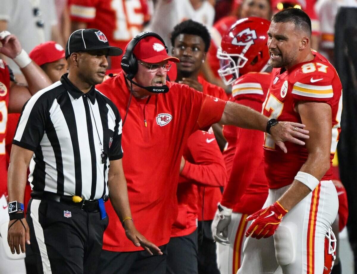 Kansas City Chiefs head coach Andy Reid and Kansas City Chiefs tight end Travis Kelce (87) argue with the official on the sideline in the Kansas City Chiefs vs. Denver Broncos NFL season opener at Arrowhead Stadium in Kansas City on Sept. 14, 2026.