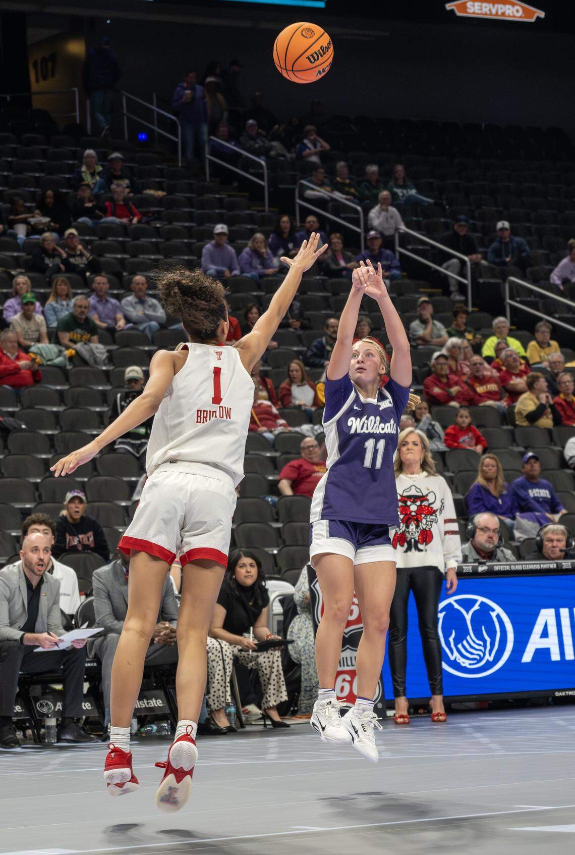 Kansas State Wildcats guard Taryn Sides (11) shoots over Texas Tech Red Raiders forward Jalynn Bristow (1) during a Big 12 Women's Basketball Tournament game at T-Mobile Center on Thursday, March 5, 2026, in Kansas City.