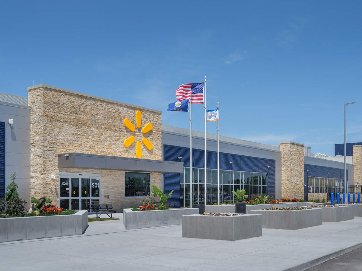 Three flags wave in front of Walmart's case-ready beef facility.