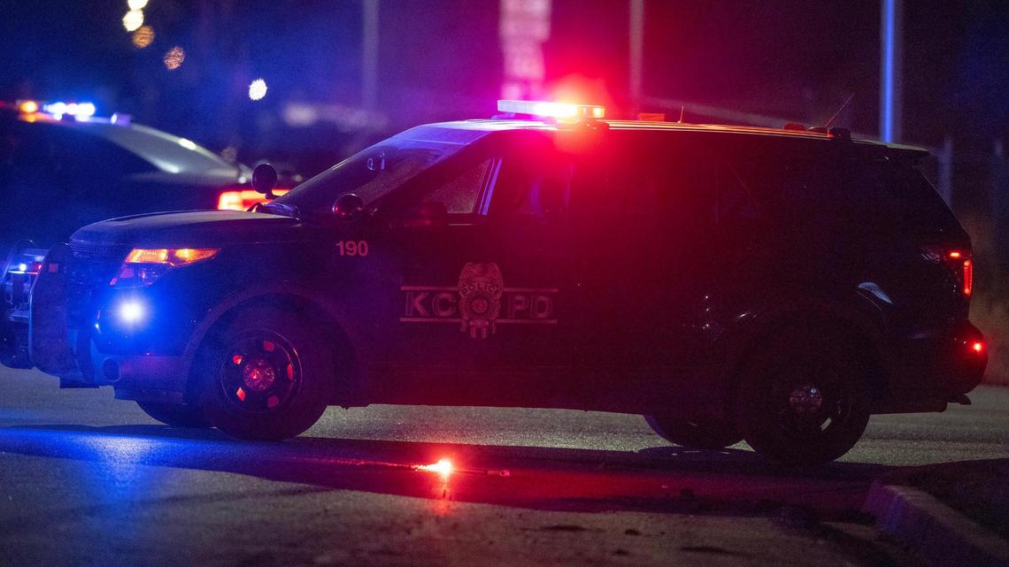 A KCPD cruiser blocks the road leading to a standoff in the 2300 block of Blue Ridge Boulevard on Tuesday, Feb. 28, 2023, in Kansas City.