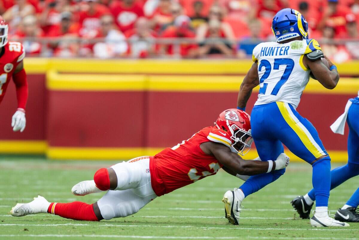 Kansas City Chiefs linebacker Jeffrey Bassa (31) makes a tackle on Los Angeles Rams running back Jarquez Hunter (27) during the first half of the Chiefs preseason game against the Los Angeles Rams, on Saturday, August 15, 2026, at Arrowhead Stadium.