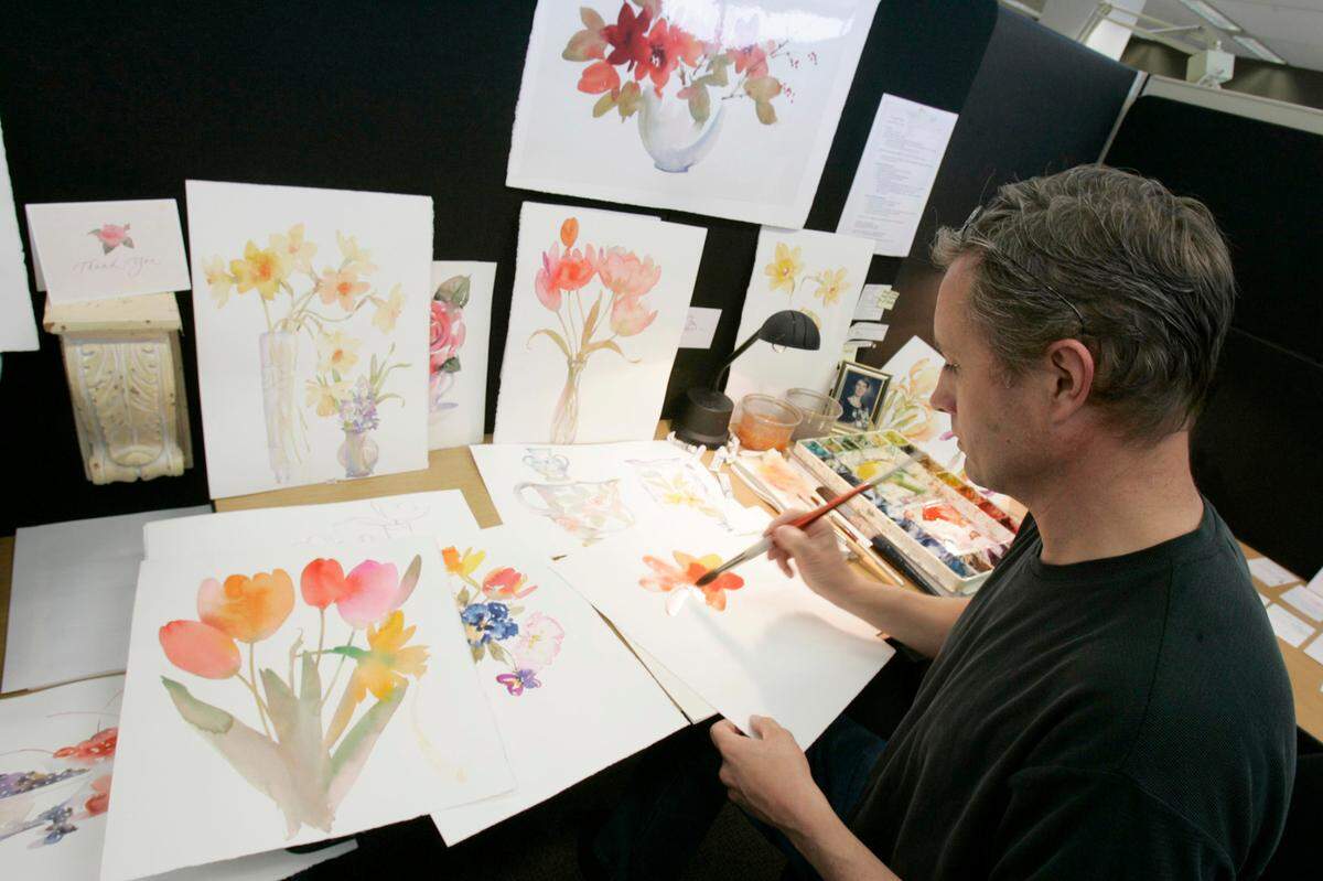 Hallmark artist Craig Lueck finds inspiration in flowers, using watercolors to create his designs for Mother’s Day cards in this 2006 photo.
