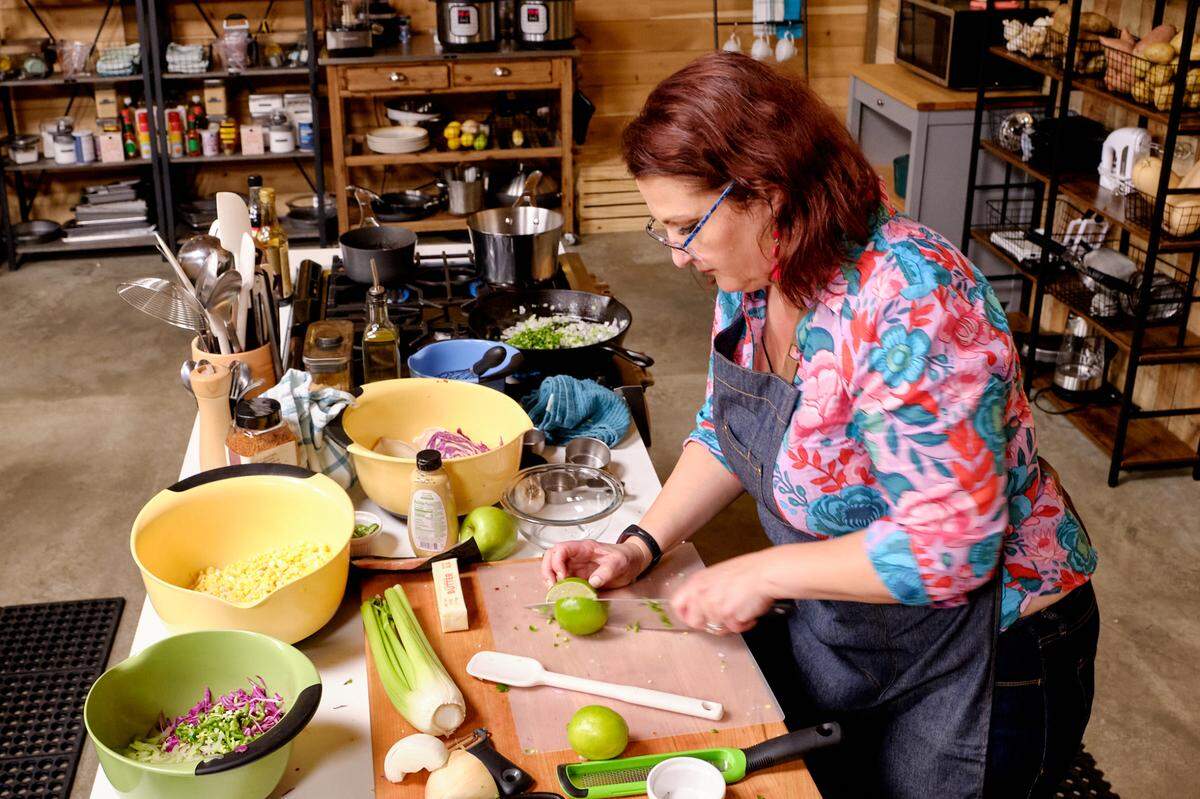 For the series, Brewer wanted to show that Kansas City has more to offer than just traditional KC barbecue. In the season premiere, Brewer cooks up glazed chicken thighs and cucumber snap pea salad as a signature dish that defines her as a cook. For the second episode, she prepared baby back ribs with cheesy corn.