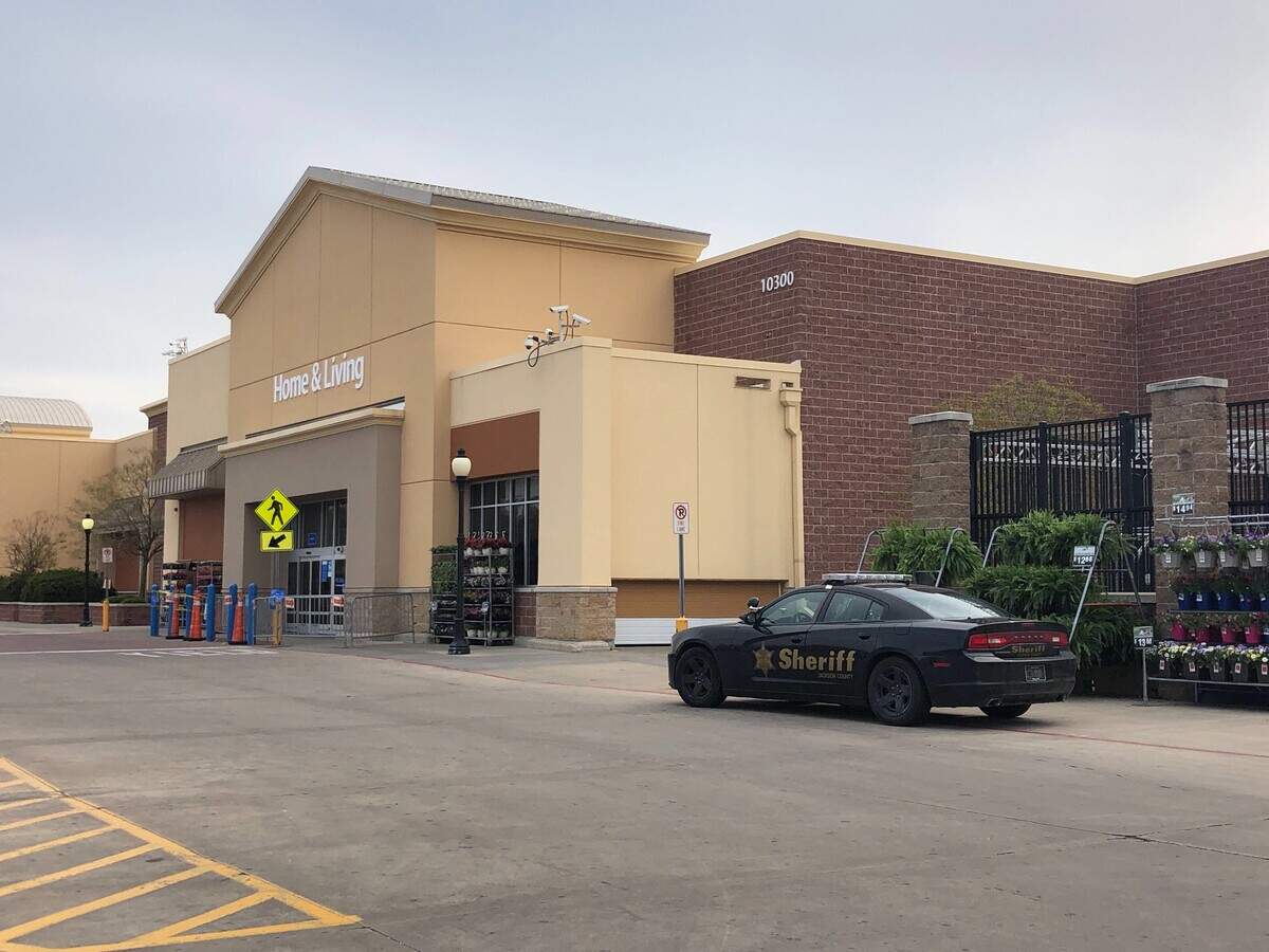 A Jackson County Sheriff’s Office patrol car was parked Sunday outside the Walmart store at 10300 E. 350 Highway in Raytown. The night before, a Raytown police officer working off-duty at the store shot and killed a man.