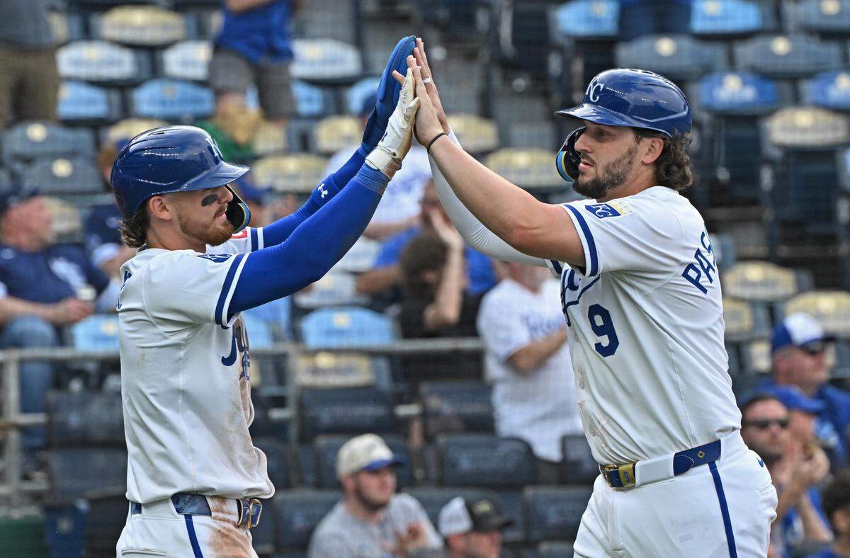 Kansas City Royals Vinnie Pasquantino (9) and Bobby Witt Jr. (7) celebrate after scoring runs in the fifth inning against the Colorado Rockies at Kauffman Stadium on Apr 24, 2025 in Kansas City, Missouri, USA.
