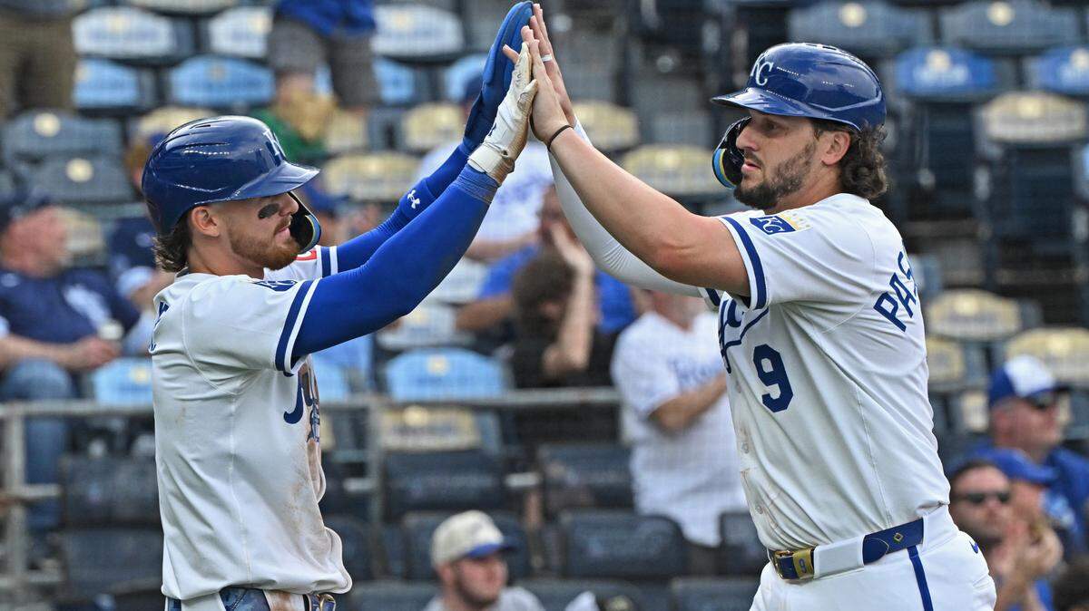 Kansas City Royals Vinnie Pasquantino (9) and Bobby Witt Jr. (7) celebrate after scoring runs in the fifth inning against the Colorado Rockies at Kauffman Stadium on Apr 24, 2025 in Kansas City, Missouri, USA.