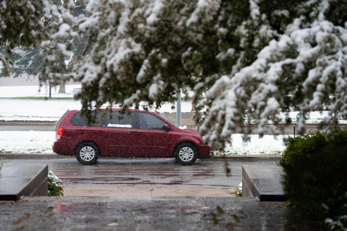 The roads turned slick as spring snow fell across the Kansas City area Tuesday morning, April 20, 2021.