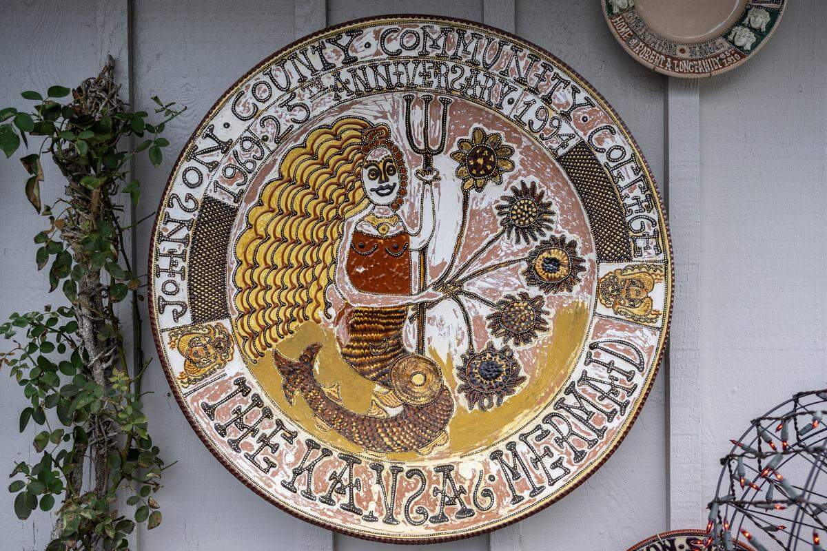 A large ceramic plate featuring a mermaid design is displayed outside the home studio of artist Irma Starr on Thursday, Dec. 11, 2025, in Kansas City.