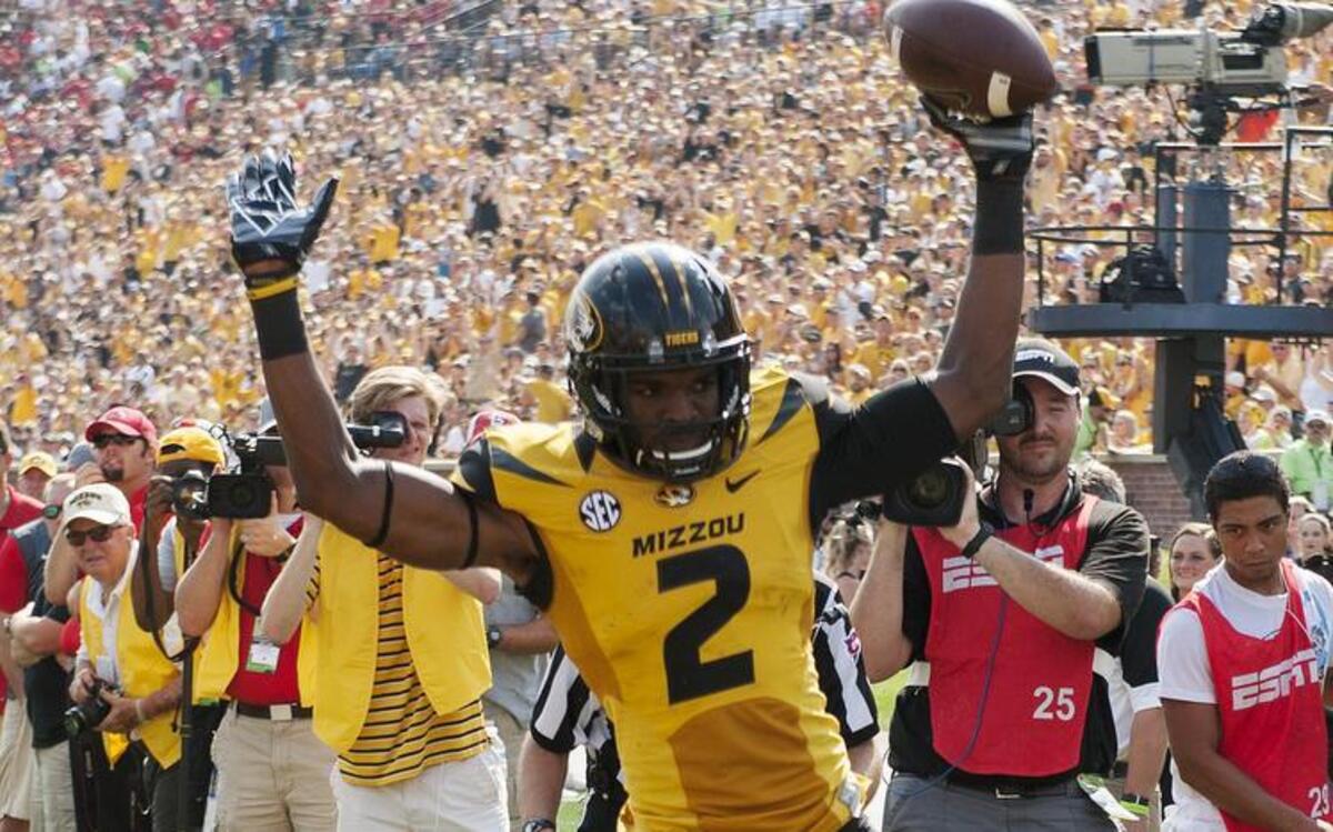 
Missouri's Nate Brown, top, celebrates a touchdown reception past Southeast Missouri State's Ryan Moore, bottom, during the first half of an NCAA college football game Saturday, Sept. 5, 2015, in Columbia, Mo. 
