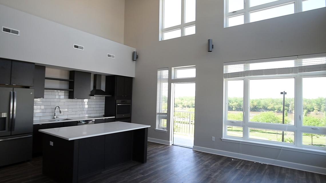 The kitchens in Union Berkley Riverfront's apartments feature quartz countertops, subway tile backsplashes and GE Energy Star appliances in a slate gray finish.
