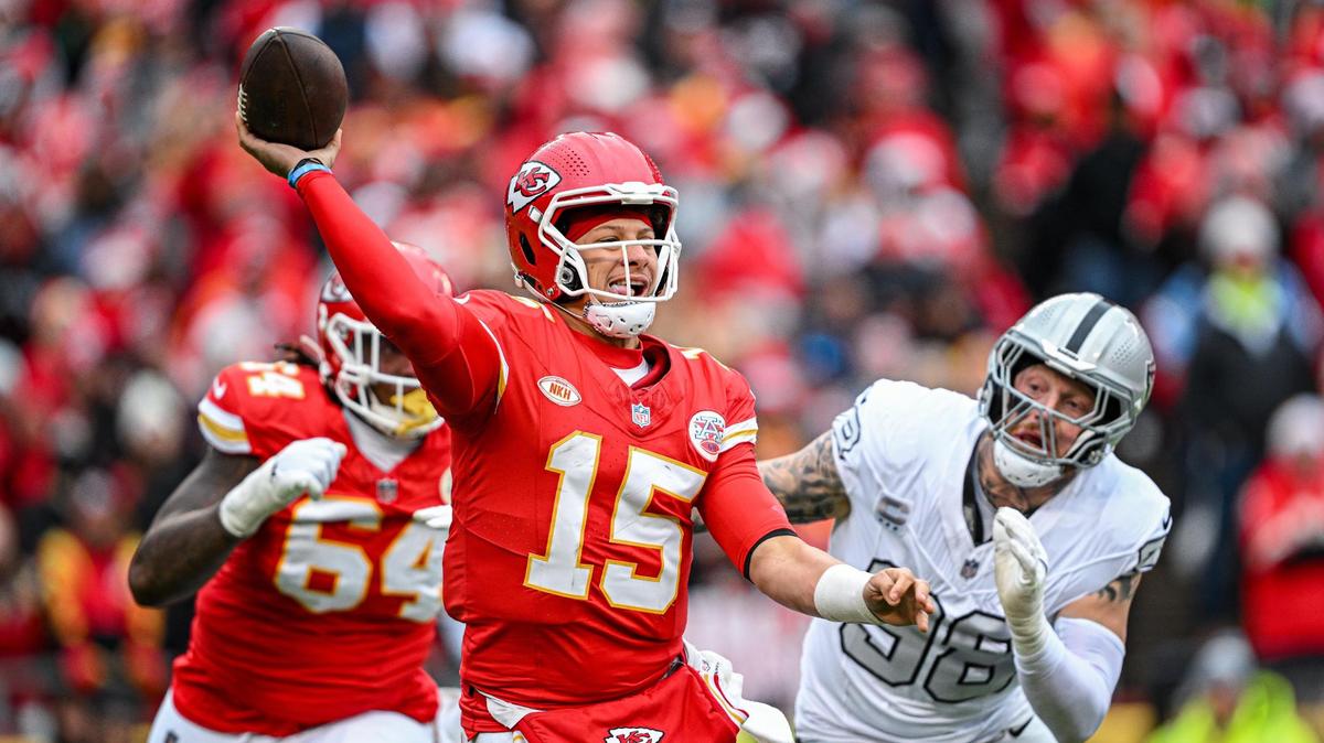 Kansas City Chiefs quarterback Patrick Mahomes (15) throws a pass in the first quarter while being pressured by Las Vegas Raiders defensive end Maxx Crosby (98) Monday, Dec. 25, 2023, at GEHA Field at Arrowhead Stadium.