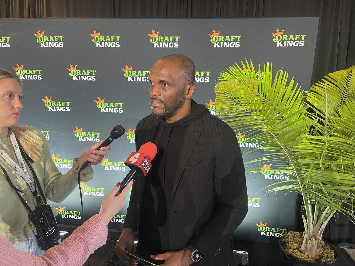 Former St. Louis Rams receiver Isaac Bruce talks with reporters at a DraftKings event to mark the rollout of Missouri’s legal sports betting industry on Dec. 1, 2025.