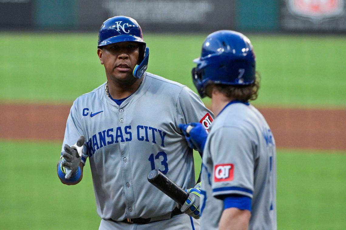 Kansas City Royals designated hitter Salvador Perez (13) is congratulated by shortstop Bobby Witt Jr. (7) after hitting a one run sacrifice fly against the St. Louis Cardinals during the fourth inning at Busch Stadium on Jul 10, 2024 in St. Louis, Missouri, USA.