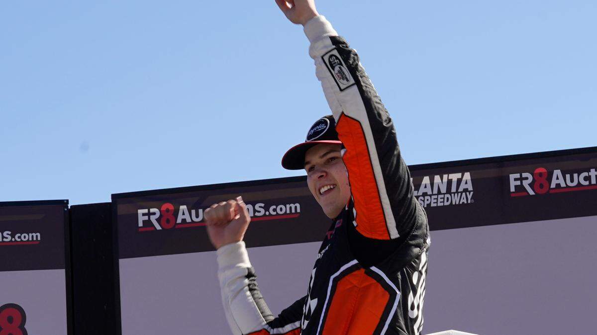 Corey Heim reacts after winning a NASCAR trucks series auto race at Atlanta Motor Speedway in Hampton, Ga., Saturday, March 19, 2022. (AP Photo/John Bazemore)