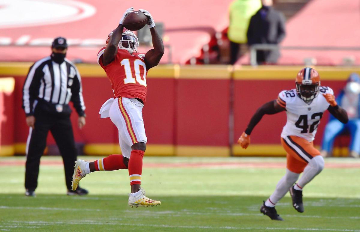 Kansas City Chiefs wide receiver Tyreek Hill pulls in a pass from quarterback Patrick Mahomes that was good for 10 yards in the first quarter against the Cleveland Browns Sunday, January 17, 2021, at Arrowhead Stadium in Kansas City, Missouri.