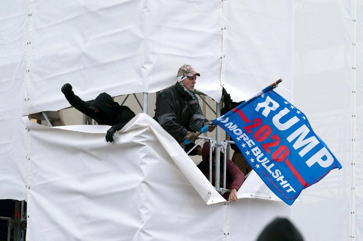 Trump supporters are seen outside the Capitol, Wednesday, Jan. 6, 2021, in Washington. As Congress prepares to affirm President-elect Joe Biden’s victory, thousands of people have gathered to show their support for President Donald Trump and his claims of election fraud. (AP Photo/Jose Luis Magana)