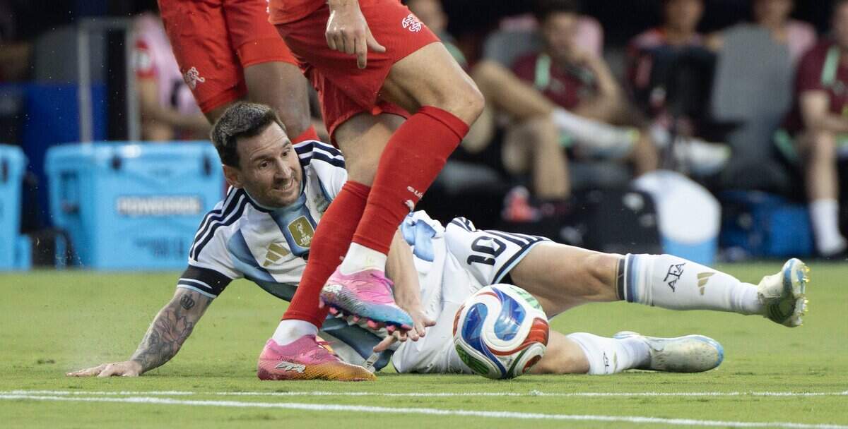 Argentina forward Lionel Messi (10) challenges two Switzerland players for the ball during the FIFA World Cup quarterfinal match at Kansas City (Arrowhead) Stadium in Kansas City on Saturday, July 11, 2026.