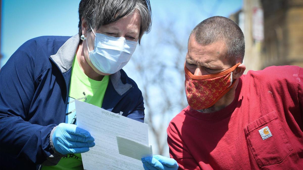 Glenda Mauer, a medical doctor from Norton, Kansas, explained the vaccination card after she gave a COVID-19 vaccination to Patrick McPherson at a clinic staffed by Care Beyond The Boulevard in April 2021. According to Texas state law, about 10.4 million vaccine records will have to be destroyed in five years unless all 10.4 million vaccine recipients consent to preserving the records.