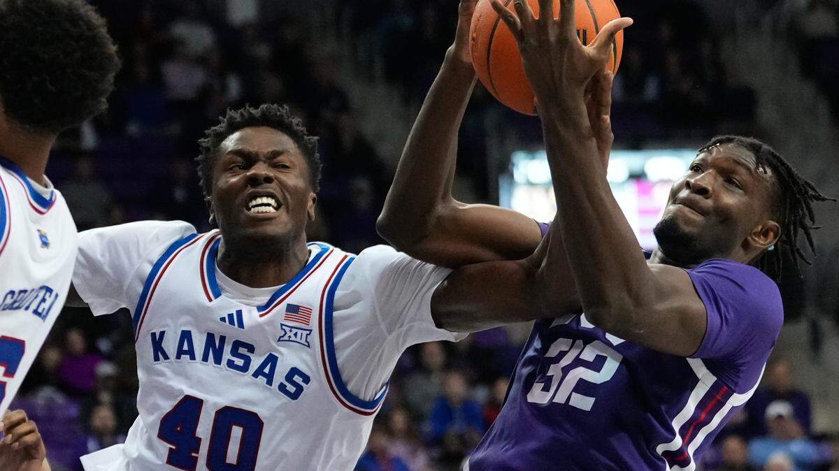 TCU Horned Frogs center Malick Diallo (32) battles for a rebound against Kansas Jayhawks forward Flory Bidunga (40) during the second half at Ed and Rae Schollmaier Arena on Jan. 22, 2025.