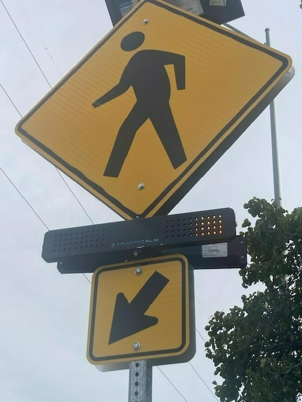 Flashing yellow lights mark the crosswalks at 51st Street and Troost Avenue, but there is no stoplight at what nearby residents say has long been a dangerous intersection.