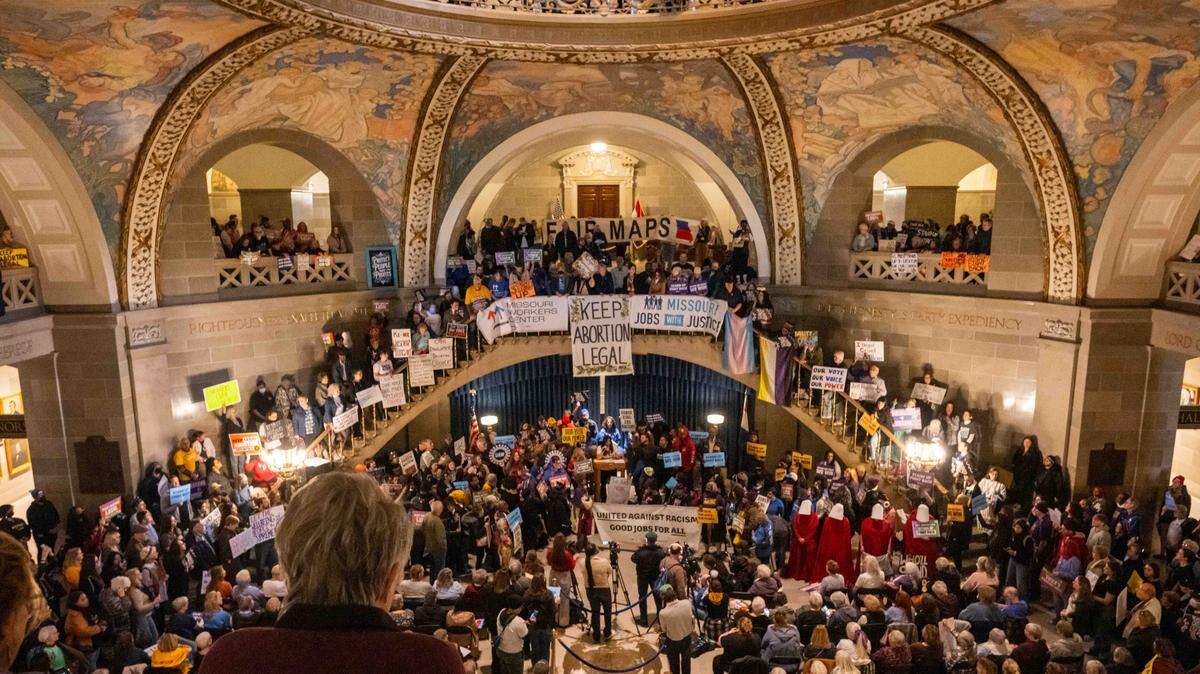 Protesters hold signs and chant in the Missouri State Capitol rotunda on Wednesday, January 21, 2026 in Jefferson City. Organizations and allies gathered to protest recent Missouri lawmaker's decisions.