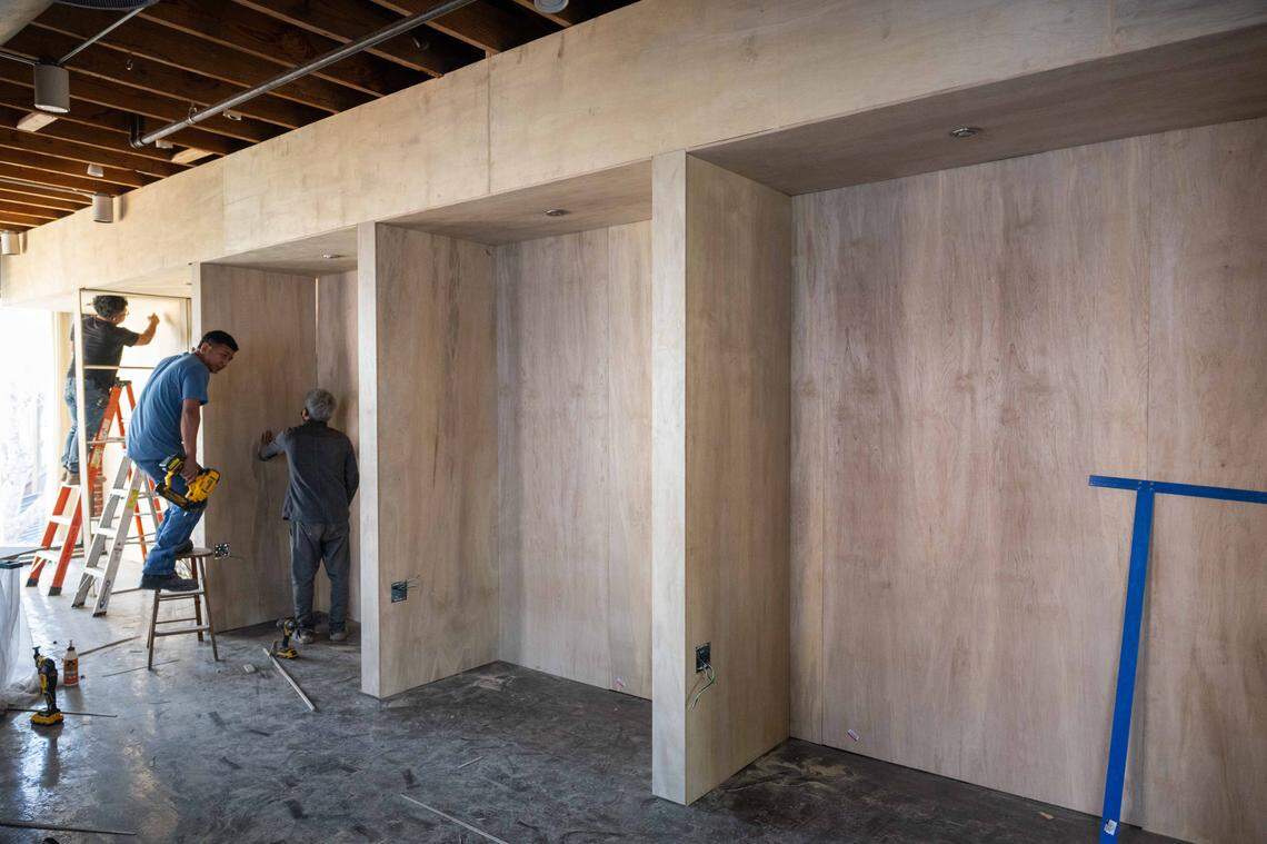 Workers continue construction of The Outsiders Social Club, a new creative space opening in Westport, on Wednesday, December 31, 2025. The social club will double as a co-working and entertainment space.