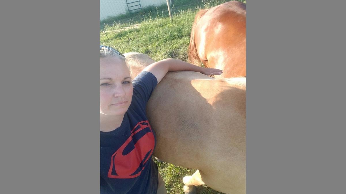 King alongside one of her four horses.