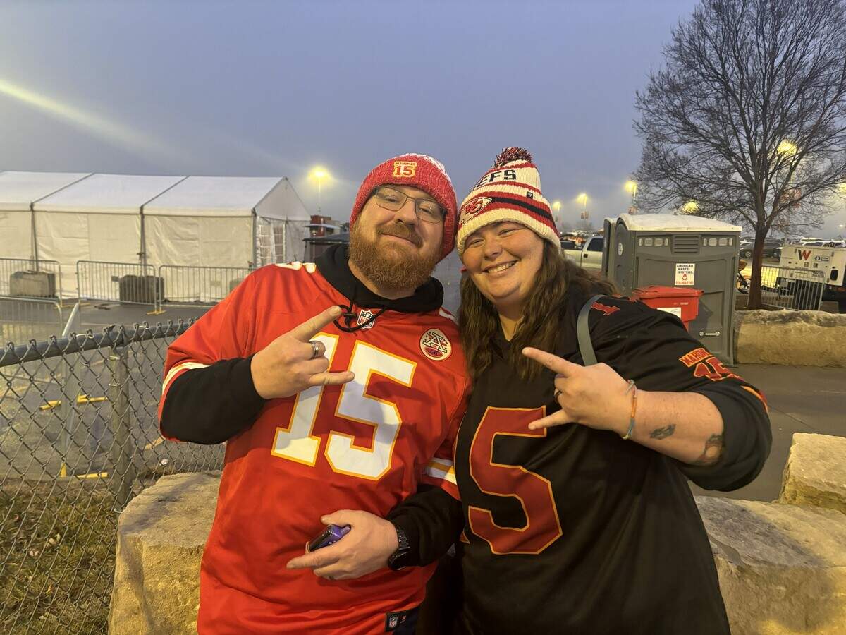 Joe Canzonere, left, and Ashley Christian wait for the gates to open at Arrowhead Stadium as the Kansas City Chiefs take on the Denver Broncos.