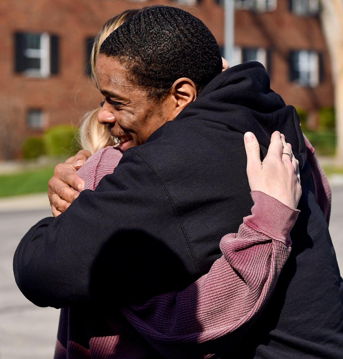 Keith Carnes hugs one of his attorneys, Taylor Rickard, after arriving at the law office for a press conference. Carnes was freed from prison Monday, April 11, 2022, after 18 years. The prosecutor’s office declined to file charges after the Missouri Supreme Court threw out his conviction for murder and armed criminal action.